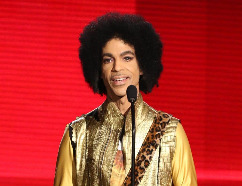 FILE - In this Nov. 22, 2015 file photo, Prince presents the award for favorite album - soul/R&amp;B at the American Music Awards in Los Angeles. Prince, widely acclaimed as one of the most inventive and influential musicians of his era with hits including &quot;Little Red Corvette,&quot; ''Let's Go Crazy&quot; and &quot;When Doves Cry,&quot; was found dead at his home on Thursday, April 21, 2016, in suburban Minneapolis, according to his publicist. He was 57. (Photo by Matt Sayles/Invision/AP, File)