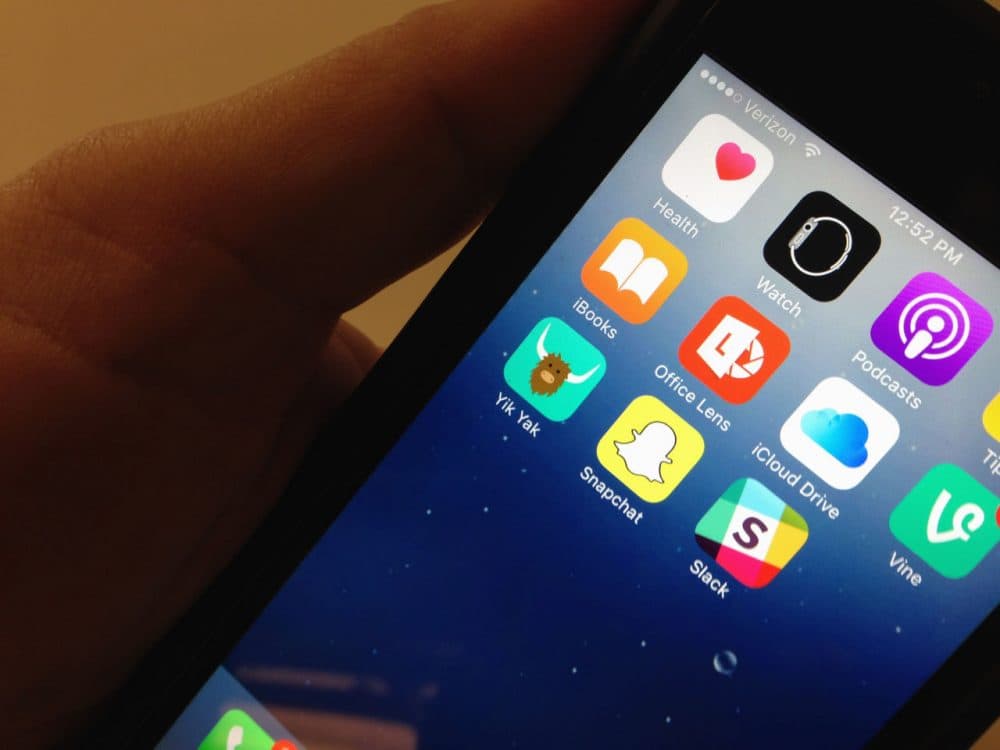 The Yik Yak app, lower, left, is seen on an iPhone on Nov. 11, 2015. (Ronald Lizik/AP)