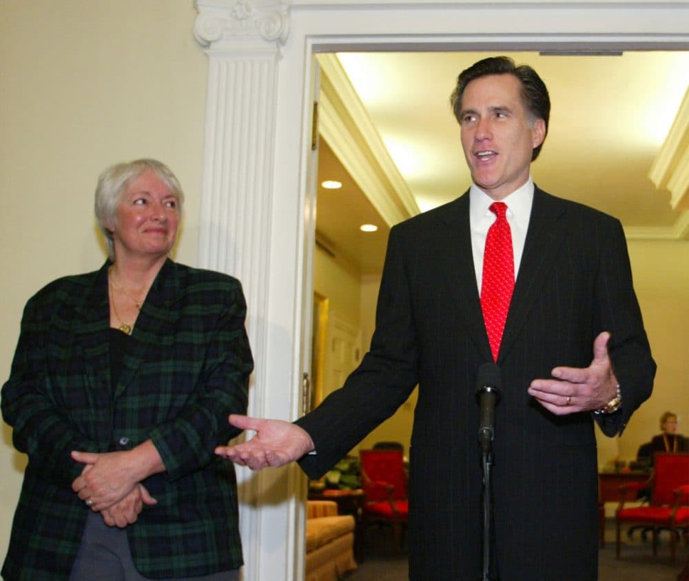 Massachusetts Gov. Mitt Romney and Barbar Anderson of Citizens for Limited Taxation, at the State House in 2004, talk about proposed state legislation to provide tax breaks for senior citizens. (Bizuayehu Tesfaye/AP)