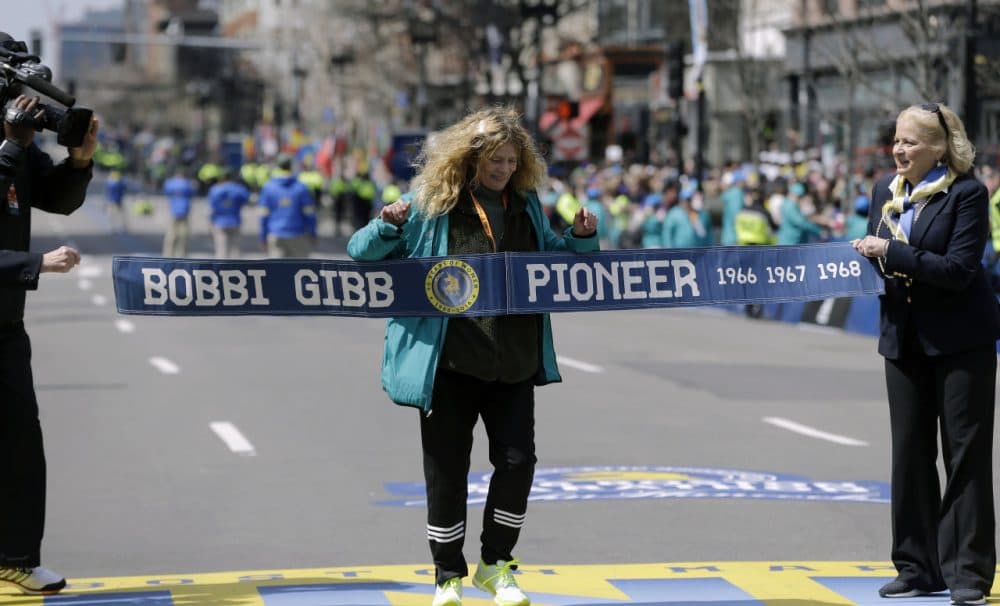Bobbi Gibb, first woman to run the Boston Marathon in 1966, crosses at the finish line of the 120th Boston Marathon on Monday. (Elise Amendola/AP)