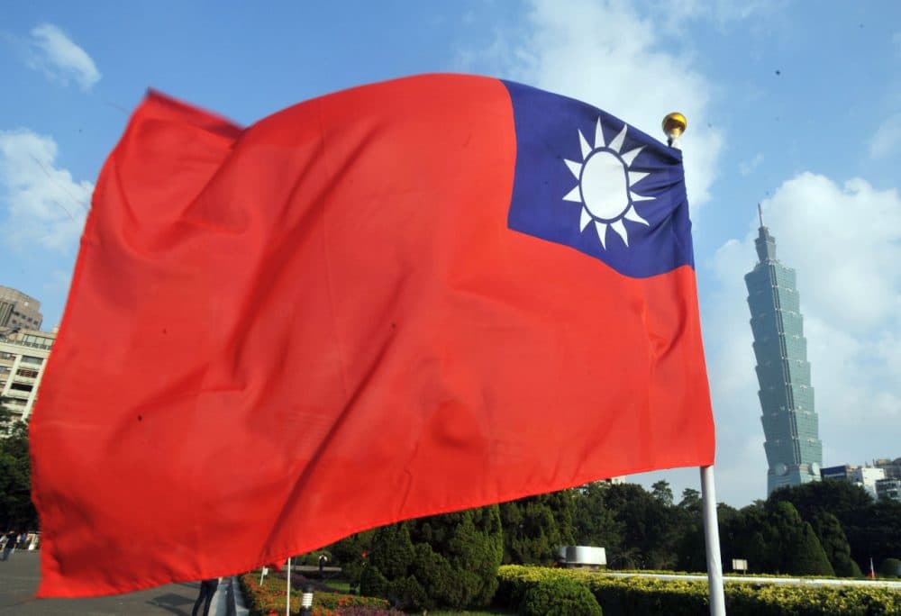 Taiwan's national flag flutters beside Taipei 101 at Sun Yat-sen Memorial Hall in Taipei on October 7, 2012. (Mandy Cheng/AFP/GettyImages)