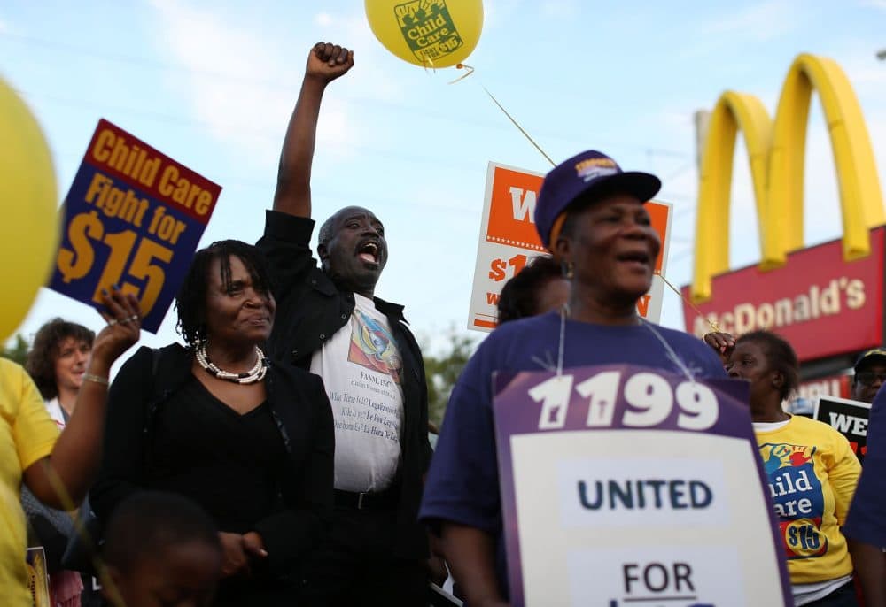 Demonstrators gather together at a McDonalds restaurant as they demand an increase in the minimum wage to $15 an hour on April 14, 2016 in Miami, Florida.  (Joe Raedle/Getty Images)