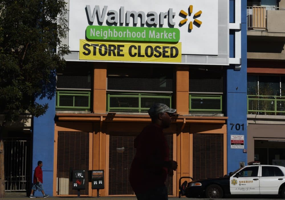 A man walks past a recently shuttered Walmart store in Chinatown that is part of the closure of 154 store locations across the United States, in Los Angeles, California on January 28, 2016.
The US retailing giant Walmart recently announced it is shuttering 269 stores inside and outside the United States, with Latin America the hardest-hit foreign market. (Mark Ralston /AFP/Getty Images)
