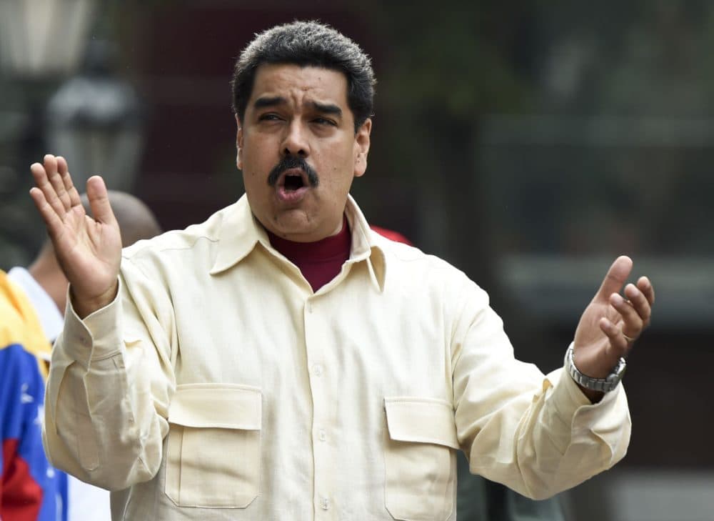 Venezuelan President Nicolas Maduro gestures at supoorters during a demonstration in Caracas on April 19, 2016. 
Venezuelan President Nicolas Maduro's six-year term reaches midpoint on Tuesday, a date few have been anticipating more eagerly than the country's opposition, which will now be able to initiate a recall referendum. (Juan Barreto/AFP/Getty Images)
