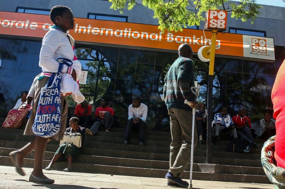 Zimbabweans queue to withdraw cash outside a bank on May 5, 2016 in Harare, Zimbabwe.  
Zimbabweans formed long queues outside banks Thursday after the government slapped new limits on cash withdrawals and announced that &quot;bond notes&quot; at par with the US dollar would be introduced. (JEKESAI NJIKIZANA/AFP/Getty Images)