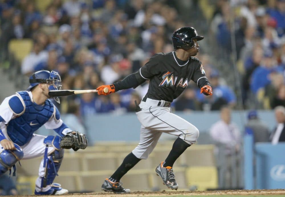 Dee Gordon, #9 of the Miami Marlins hits an RBI single in the seventh inning against the Los Angeles Dodgers at Dodger Stadium on April 28, 2016 in Los Angeles, California. (Stephen Dunn/Getty Images)
