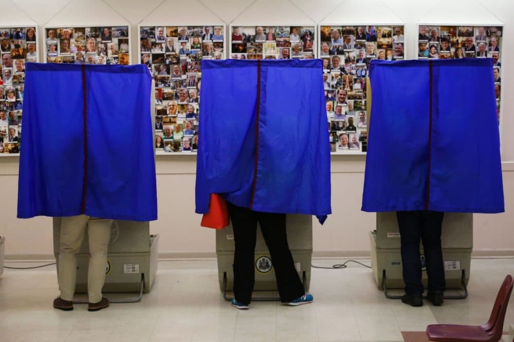 People cast their ballots in a polling station during the presidential primary election on April 26, 2016 in Philadelphia, Pennsylvania.
Five US states began voting Tuesday at a critical juncture in the presidential race, with Hillary Clinton seeking a knockout against Bernie Sanders and Republican Donald Trump confident of extending his lead despite rivals joining forces against him. (Eduardo Munoz Alvarez /AFP/Getty Images)