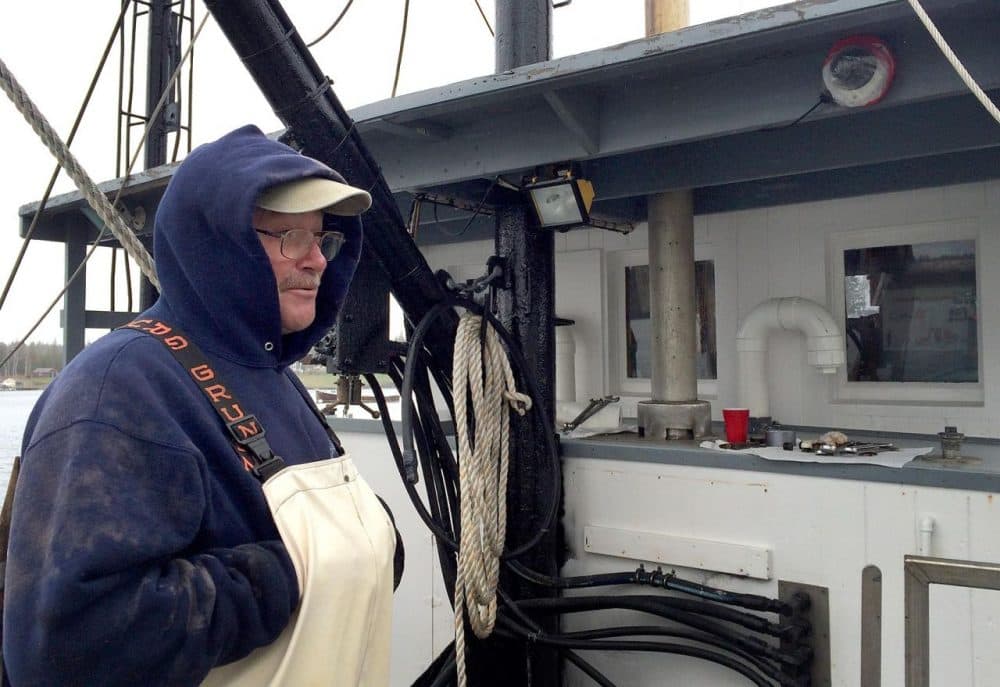 Randy Cushman is aboard his fishing vessel Ella Christine, in Port Clyde, Maine. In the top righthand corner, you can see one of the cameras used to monitor his catch and fishing activities. (Qainat Khan/WBUR)