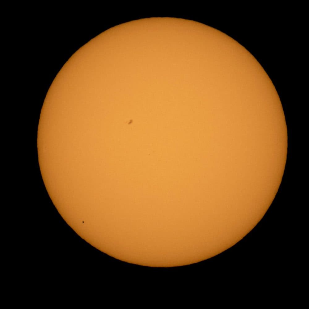 The planet Mercury is seen in silhouette, lower left, as it transits across the face of the sun Monday, May 9, 2016. The last time it happened was 2006. (Bill Ingalls/NASA via AP)