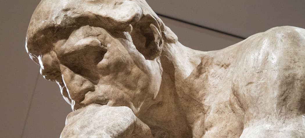 A close-up of the chiseled sculpture, &quot;The Thinker&quot; by Auguste Rodin. It's now the centerpiece of a new exhibit at the Peabody Essex Museum that is showcasing several of the prolific artist's works. (Andrea Shea/WBUR)