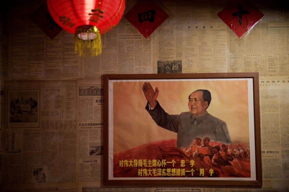 A poster showing the late Chinese chairman Mao Zedong hangs on a wall inside a restaurant in Beijing on May 13, 2016.
Fifty years after the Cultural Revolution spread bloodshed and turmoil across China, the Communist-ruled country is driving firmly down the capitalist road, but Mao Zedong's legacy remains -- like the embalmed leader himself -- far from buried. (Nicolas Asfouri/AFP/Getty Images)