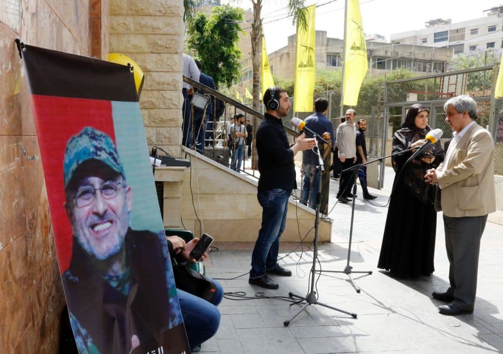 Lebanese press report from outside where family members are receiving condolences for the death of top Hezbollah commander Mustafa Badreddine who was killed in an attack in Syria in a southern suburb of Beirut on May 13, 2016. 
Lebanese militant group Hezbollah announced that its top military commander had been killed in an attack in Syria in a major blow to the coalition supporting the Damascus regime.
 (Anwar Amro/AFP/Getty Images)
