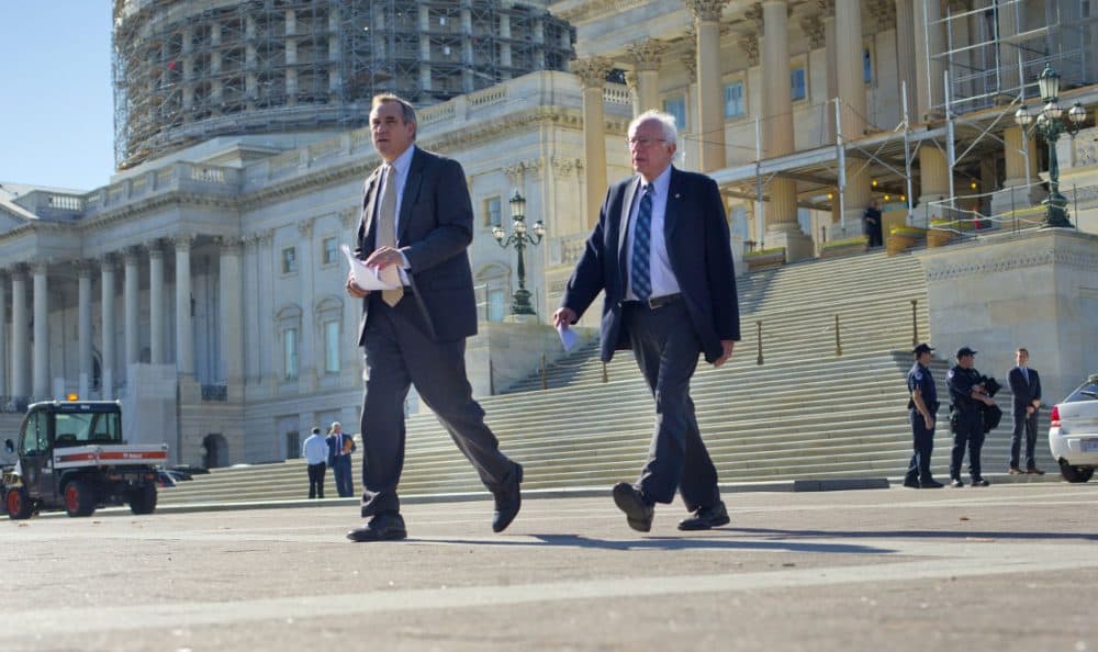 On Wednesday, Nov. 4, 2015, Democratic presidential candidate Sen. Bernie Sanders, I-Vt., right, and Sen. Jeff Merkley, D-Ore. walked to a news conference on Capitol Hill in Washington to announce new climate legislation. (Pablo Martinez Monsivais/AP)