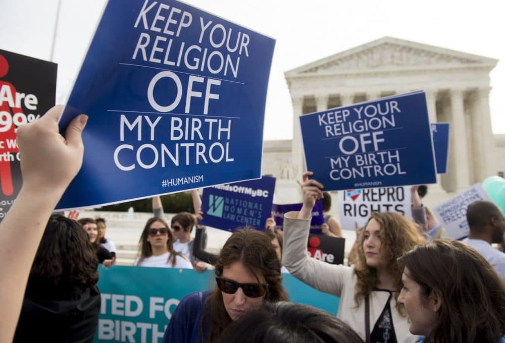 Supporters of women's health rally outside the Supreme Court in Washington, DC, March 23, 2016, as the Court hears oral arguments in 7 cases dealing with religious organizations that want to ban contraceptives from their health insurance policies on religious grounds. (Saul Loeb/AFP/Getty Images)