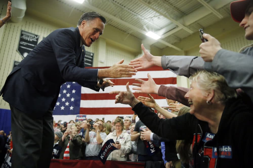 Former Republican presidential candidate Mitt Romney meets with attendees at a campaign stop for former Republican presidential candidate Ohio Gov. John Kasich in March in Westerville, Ohio. (Matt Rourke/AP)