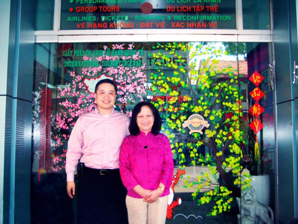 Tony Nong stands with his mother, Ann Tran, in front of Ann Tours in Ho Chi Minh City, Vietnam. (Courtesy/Tony Nong)