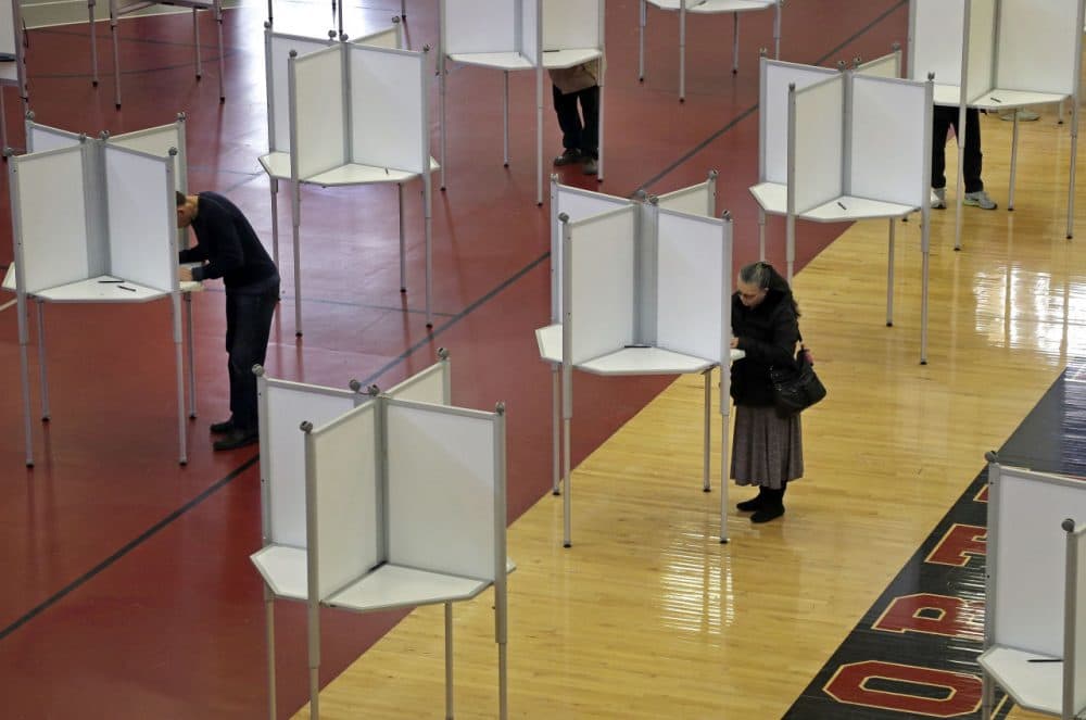 In North Reading, Mass., voters cast ballots at a polling station for Massachusetts' primary election held in March.  (Elise Amendola/AP)