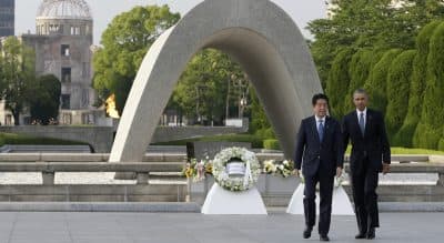 U.S. President Barack Obama and Japanese Prime Minister Shinzo Abe walk after laying wreaths at the cenotaph at Hiroshima Peace Memorial Park in Hiroshima, western Japan, Friday, May 27, 2016. President Obama visited Hiroshima on Friday, after the Group of Seven summit in central Japan, becoming the first sitting American president to do so. (Carolyn Kaster)