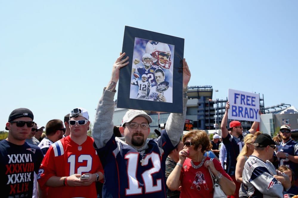 FOXBORO, MA - MAY 24:  Paul Goodrow of Watertown, Massachusetts holds a sign in support of New England Patriots quarterback Tom Brady at the &quot;Free Tom Brady&quot; rally at Gillette Stadium on May 24, 2015 in Foxboro, Massachusetts. The rally was held in protest of Brady's four game suspension for his role in the &quot;deflategate&quot; scandal.  (Photo by Maddie Meyer/Getty Images)