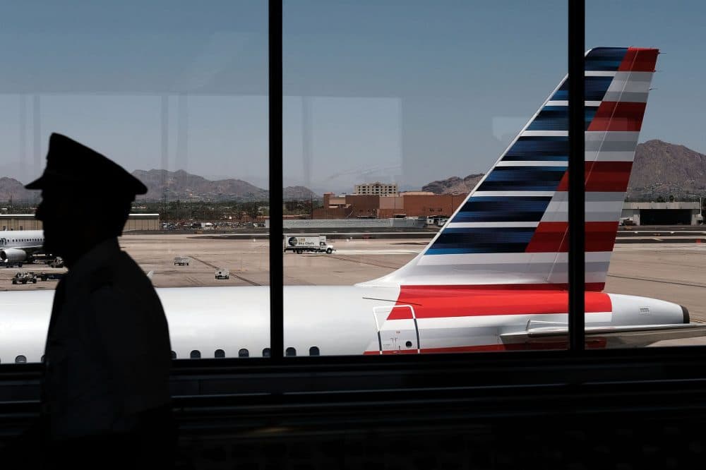 A pilot walks through the Phoenix airport on May 24, 2016 in Phoenix, Arizona. (Spencer Platt/Getty Images)