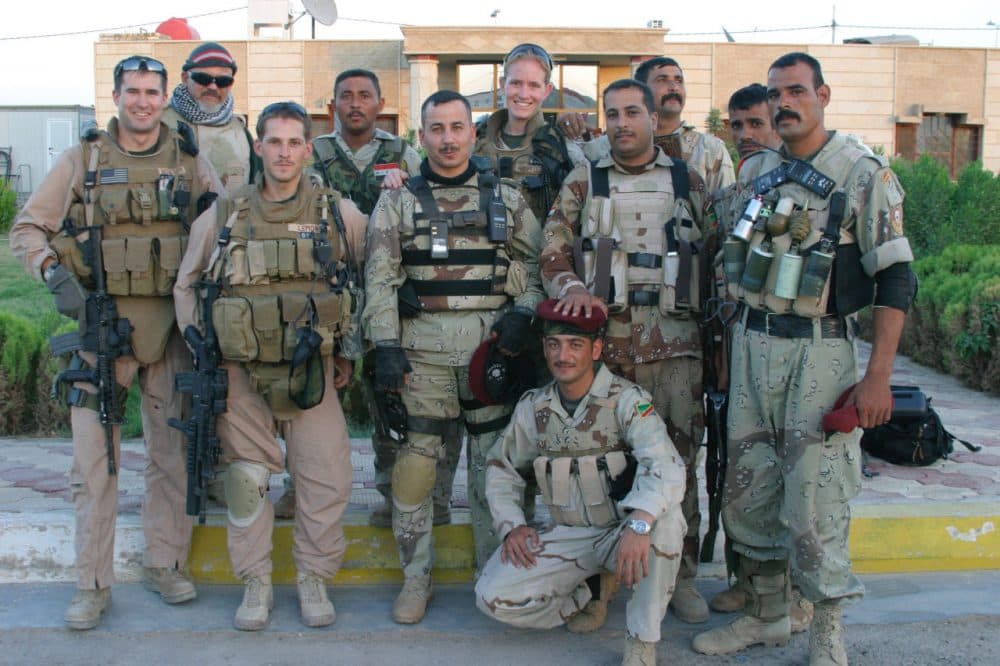 Rep. Seth Moulton, then a Marine Captain, stands alongside both American and Iraqi soldiers in Iraq. Lt. Col Ehab Hashem Moshen is in the center of the second row. (Courtesy, Rep. Seth Moulton)