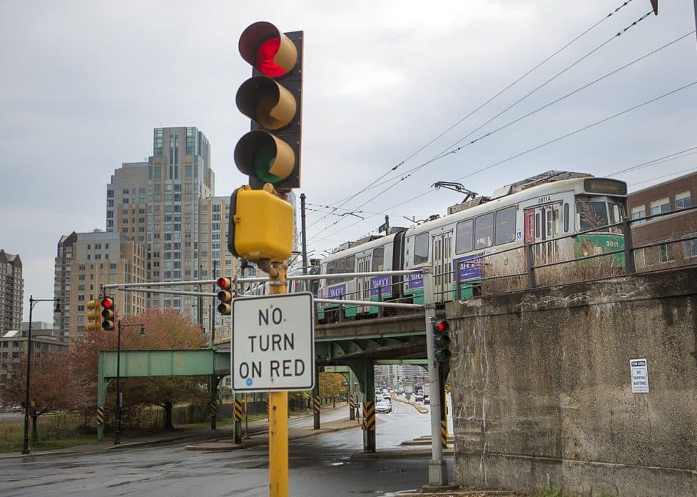 An MBTA Green Line trolley on the overpass of Route 28 pulls into Lechmere Station in Cambridge. (Jesse Costa/WBUR)