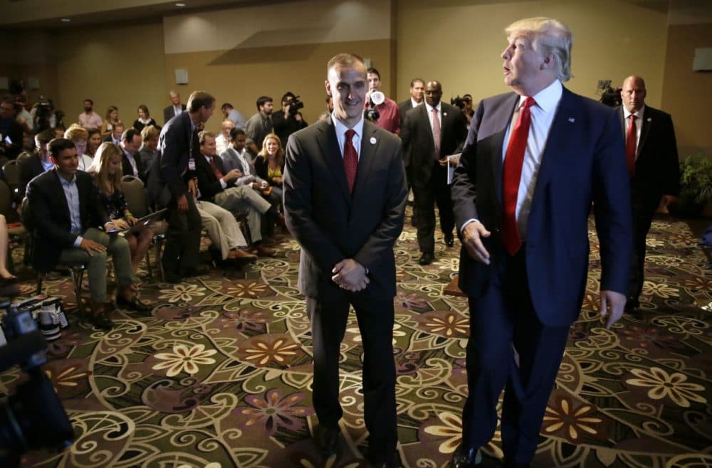 In this file photo, Republican presidential candidate Donald Trump walks with his campaign manager Corey Lewandowski after a press conference in Iowa. (Charlie Neibergall/AP)