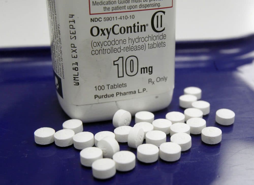 While most say medication-assisted treatment for opioid addiction improves patient outcomes, some doctors are questioning seeking a cure from the same industry they say caused the problem. Pictured here, OxyContin, an opioid, is seen in a pharmacy in 2013. (Toby Talbot/AP/File)