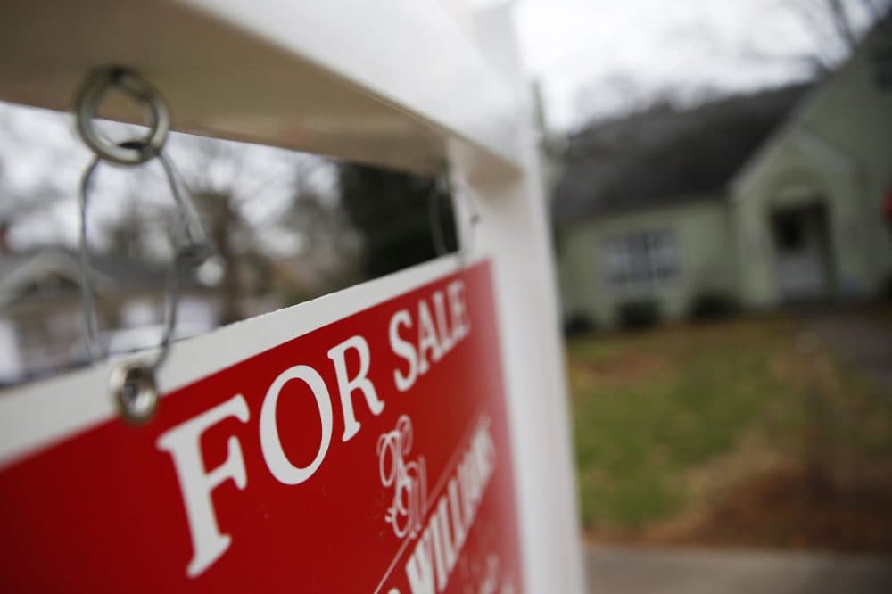This Jan. 26, 2016 file photo shows a &quot;For Sale&quot; sign hanging in front of an existing home in Atlanta.(John Bazemore, File/AP)