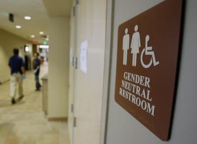 A sign marks the entrance to a gender-neutral restroom at the University of Vermont in Burlington, Vt. Nearly all of the nation's 20 largest cities, including New York City, have local or state nondiscrimination laws that allow transgender people to use whatever bathroom they identify with, though a debate has raged around the topic nationwide. (Toby Talbot/AP)