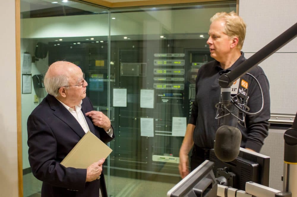 Larry Kirby, a WWI veteran, stands in the On Point studio with host Tom Ashbrook on April , 2016. (Sarah Platt / WBUR)