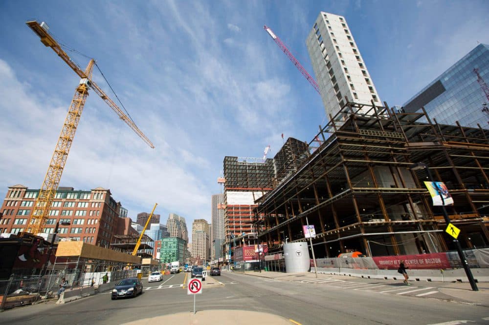 The gap between the rich and the poor is a theme that increasingly defines the city of Boston, with its booming innovation economy -- and its growing number of people struggling at the bottom of the economic ladder. Here's construction in the heart of South Boston’s Innovation District in March. (Jesse Costa/WBUR)