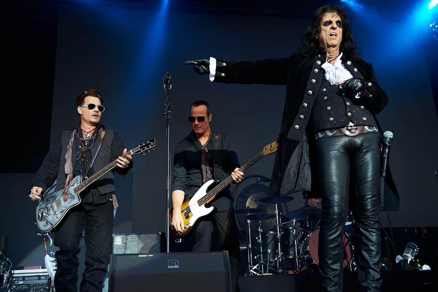 Johnny Depp, left, and Alice Cooper, right, lead the Hollywood Vampires during a performance in Denmark on June 1. (Claus Bonnerup/Polfoto via AP)