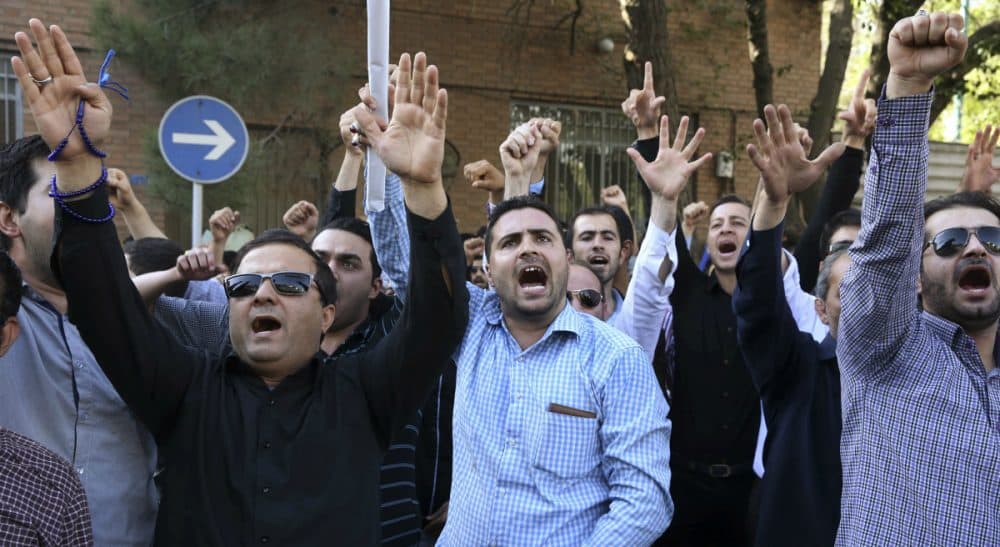 In this Sept. 27, 2015 photo, Iranian protesters chant slogans in front of the Saudi Arabian Embassy in Tehran, Iran, during a gathering to blame the Arab country for a deadly stampede during the annual hajj pilgrimage. (Vahid Salemi/AP)