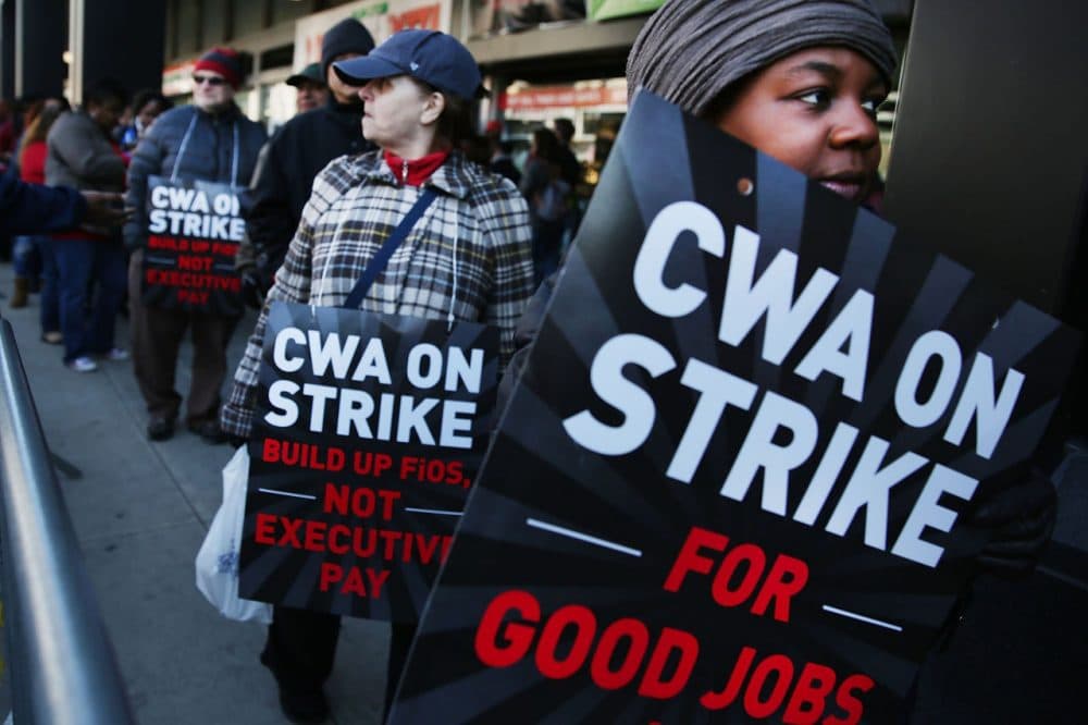 Hundreds of Verizon workers strike outside of the telecommunications company's Brooklyn offices on April 13, 2016 in New York City. Some officials are blaming the strike in part for weaker than anticipated job gains in May. (Spencer Platt/Getty Images)
