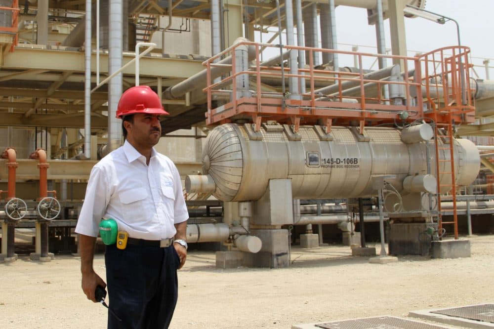 An Iranian worker stands in front of a construction during a visit by Iranian Journalists to the South Pars gas field development phases (5-8) in the southern Iranian port town of Asaluyeh on July 19, 2010. ( ATTA KENARE/AFP/Getty Images)