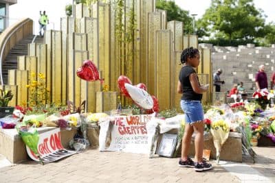 Mourners gather at a memorial  following the death of boxing legend Muhammad Ali outside the Muhammad Ali Center June 4, 2016 in Louisville, Kentucky.  Ali died at a Phoenix-area hospital, where he had spent the past few days being treated for respiratory complications.  (Aaron P. Bernstein/Getty Images)