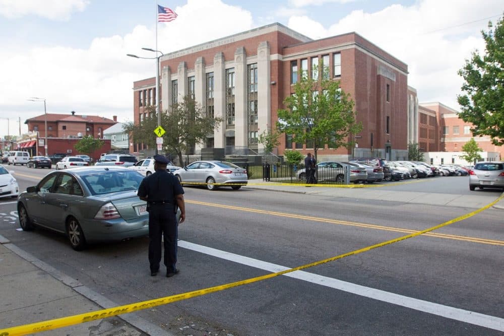 A Boston high school student was killed and three others wounded in a shooting near Jeremiah E. Burke High School on Washington Street in Dorchester on Wednesday afternoon. (Joe Difazio for WBUR)
