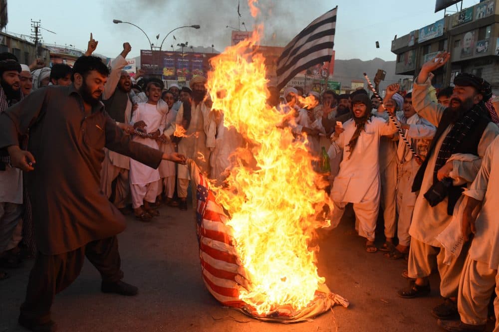 Pakistani Sunni Muslim supporters of hard line pro-Taliban party Jamiat Ulema-i-Islam-Nazaryati (JUI-N) torch a US flag during a protest in Quetta on May 25, 2016, against a US drone strike in Pakistan's southwestern province Balochistan in which killed Afghan Taliban leader Mullah Akhtar Mansour. (BANARAS KHAN/AFP/Getty Images)