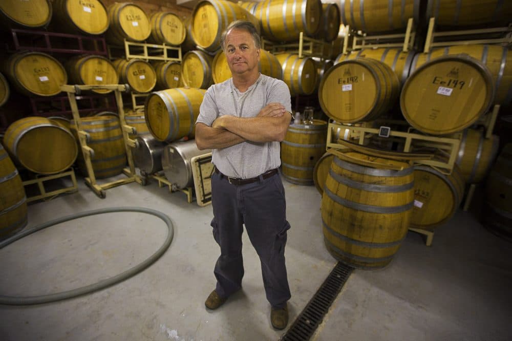 Nashoba Valley Winery owner Rich Pelletier in the cask room (Jesse Costa/WBUR)