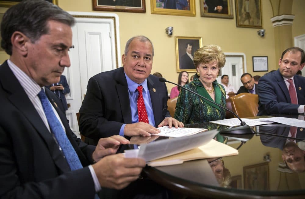 From left, Rep. Gary Palmer, R-Ala., Del. Gregorio Kilili Camacho Sablan, D-Northern Mariana Islands, Del. Madeleine Bordallo, D-Guam, and Rep. Andy Barr, R-Ky., go before the House Rules Committee to prepare a bill for floor debate that would create a financial control board for Puerto Rico and restructure some of the U.S. territory's $70 billion debt, at the Capitol in Washington, Wednesday, June 8, 2016. (AP Photo/J. Scott Applewhite)