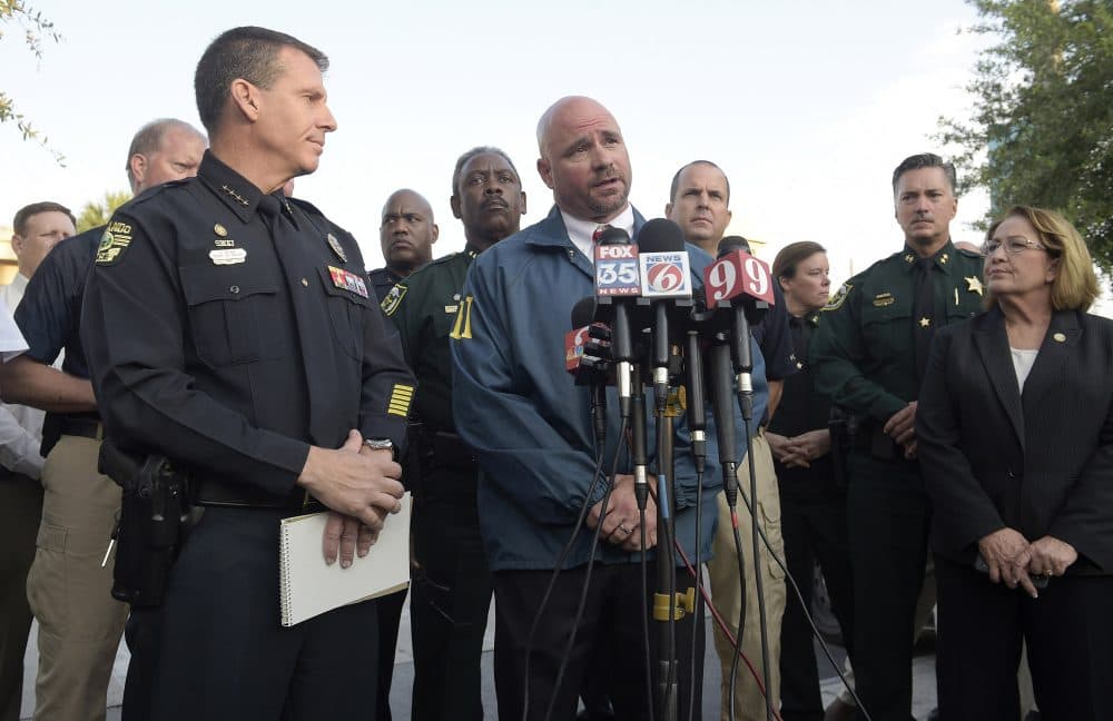 FBI assistant special agent in charge Ron Hopper, center, answers questions from members of the media on Sunday morning. Listening are Orlando Police Chief John Mina, left, and Orange County Mayor Teresa Jacobs. (Phelan M. Ebenhack/AP)