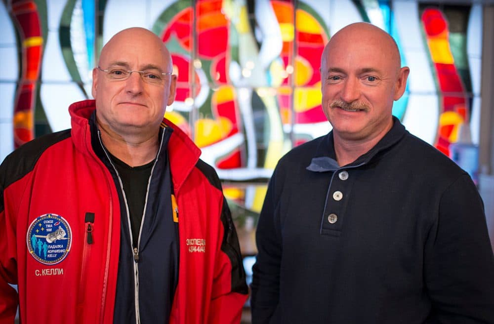 Expedition 43 NASA Astronaut Scott Kelly, left, and his identical twin brother Mark Kelly, pose for a photograph Thursday, March 26, 2015 at the Cosmonaut Hotel in Baikonur, Kazakhstan. (Bill Ingalls/NASA via Getty Images)