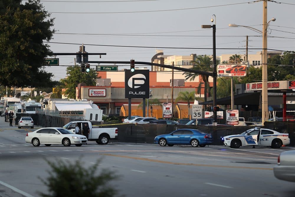 Law enforcement officials investigate near the Pulse Nightclub where Omar Mateen allegedly killed at least 50 people on June 13, 2016 in Orlando, Florida. (Joe Raedle/Getty Images)
