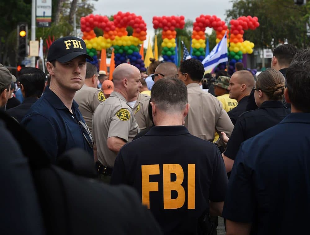 FBI agents keep watch during the 2016 Gay Pride Parade in West Hollywood, California on June 12, 2016. Security for the tightened in the aftermath of the deadly shootings June 12 at the Pulse, a packed gay nightclub in Orlando, Florida. (Mark Ralston/AFP/Getty Images)