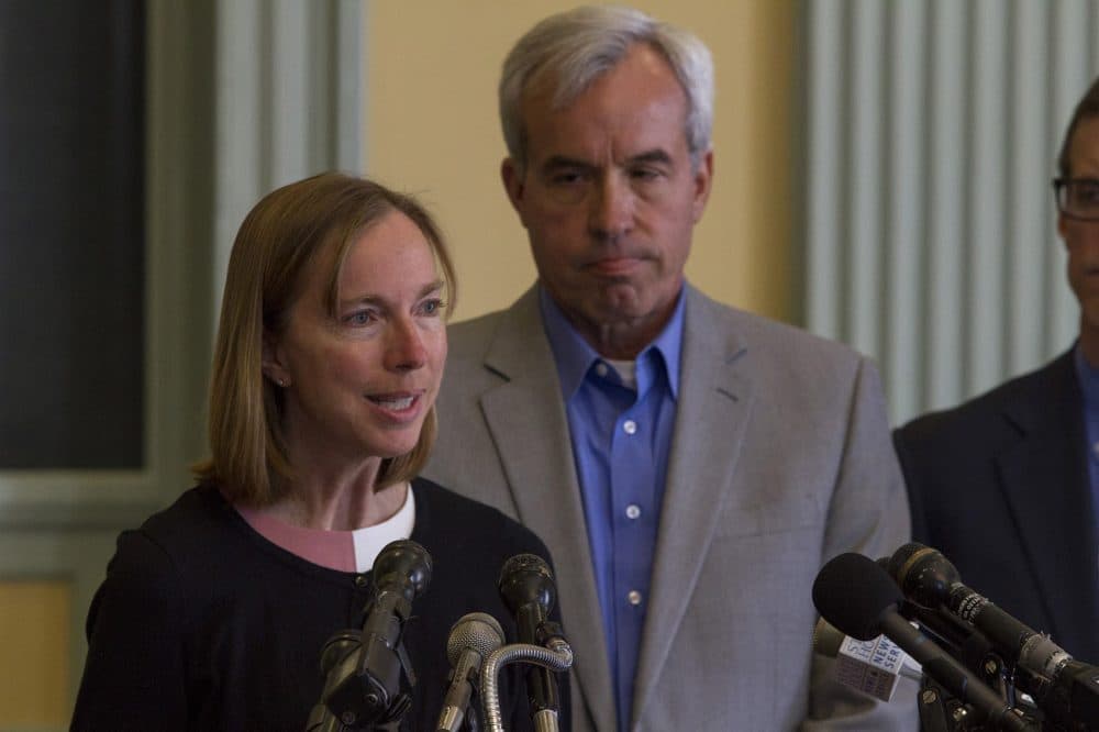 Ivan and Martha Warmuth, whose daughter Allison was killed by a duck boat, announce new legislation aimed to improve safety of sightseeing vehicles. (Joe Difazio for WBUR)