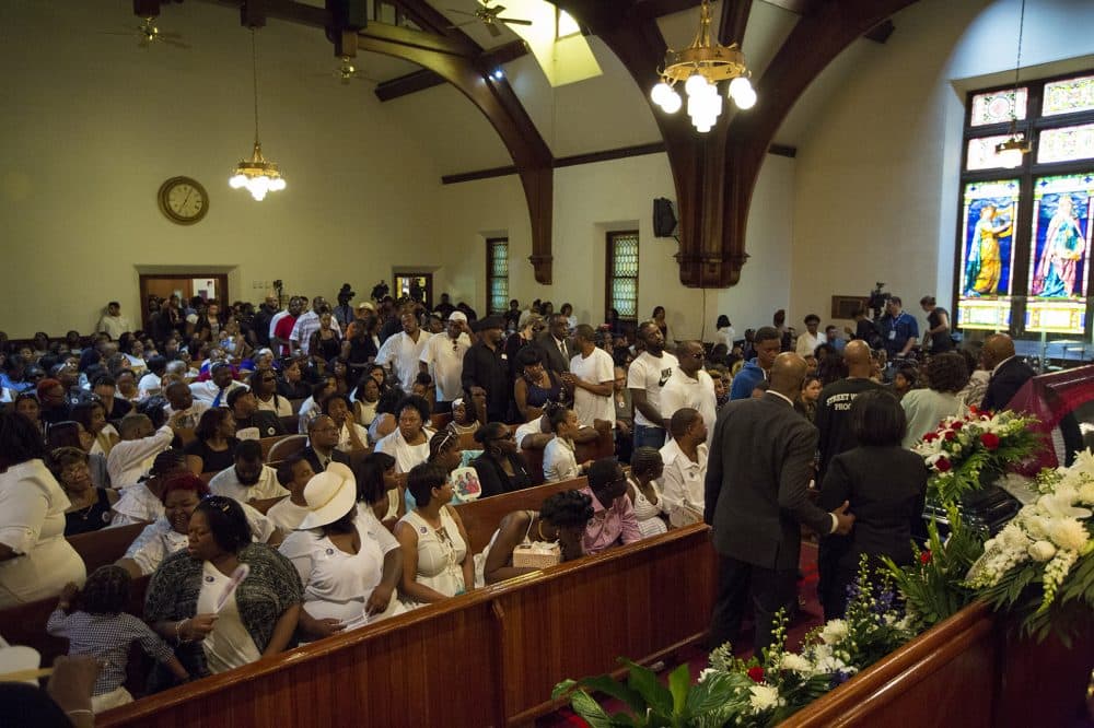 Mourners filled the Charles Street AME Church and waited in a line flowing outside as they paid their respects to Raekwon during the wake. (Jesse Costa/WBUR)
