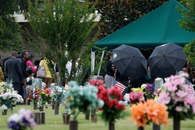 After the viewing and funeral service, mourners gather at the burial site for Kimberly Morris, June 16, 2016 in Kissimmee, Florida. (Drew Angerer/Getty Images)