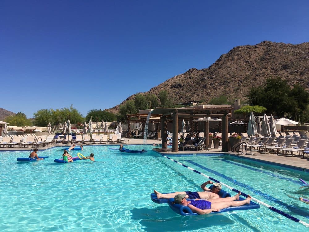 Hotel guests cool off at the pool at the JW Marriott Scottsdale Camelback Inn Resort and Spa in Paradise Valley, Ariz., on Sunday, June 19, 2016. States in the Southwest are in the midst of a summer heat wave as a high pressure ridge bakes Arizona, California and Nevada with extreme, triple-digit temperatures. (Anna Johnson/AP)