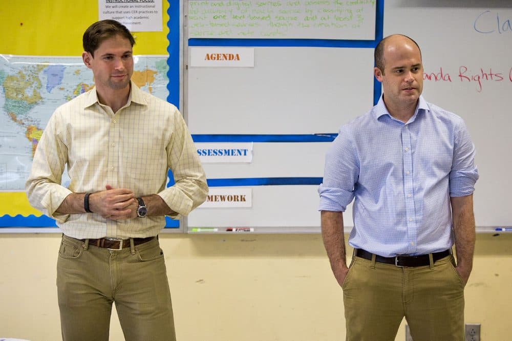 Attorneys Nate Koslof, left, and Clark Freeman lead the Law Day session at Lilla Frederick Middle School. They said they were impressed with the students questions about Miranda rights. (Jesse Costa/WBUR)